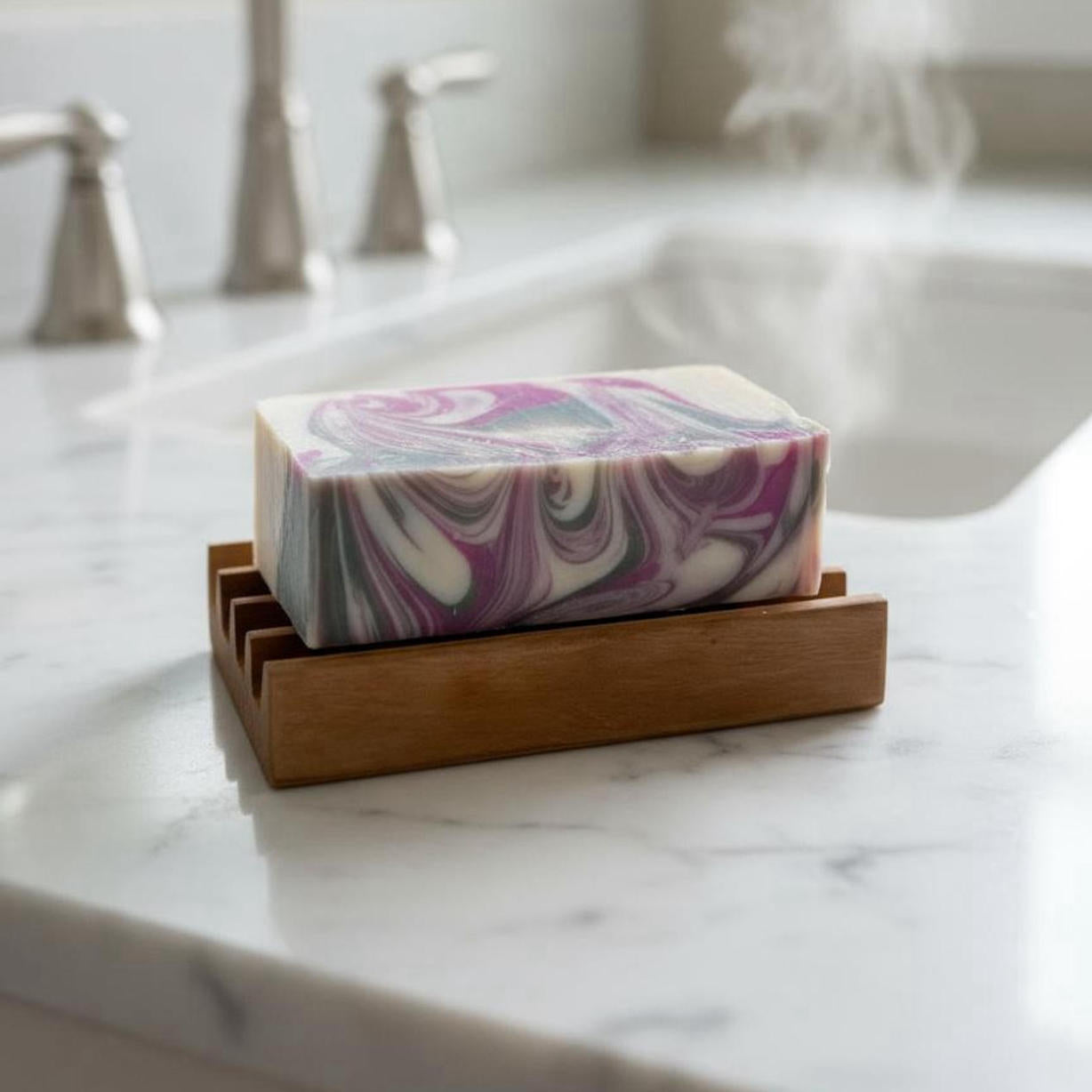 Marbled soap bar in a wooden holder on a marble countertop