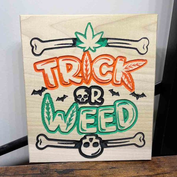 Handcarved trick or weed sign