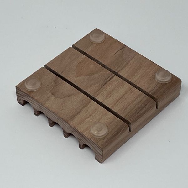 Rubber feet on wooden soap dish to help soap dish not slide